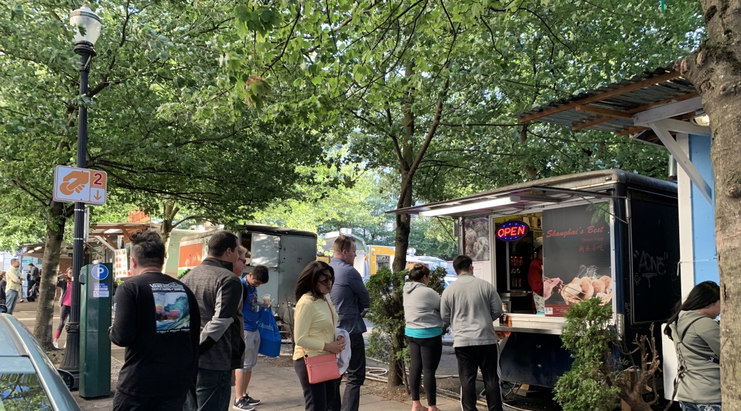 Photo of people ordering food from food carts